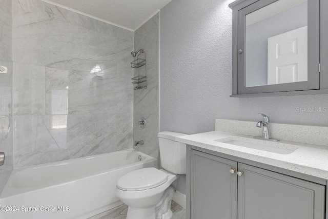 full bath with shower / bath combination, vanity, toilet, and a textured wall