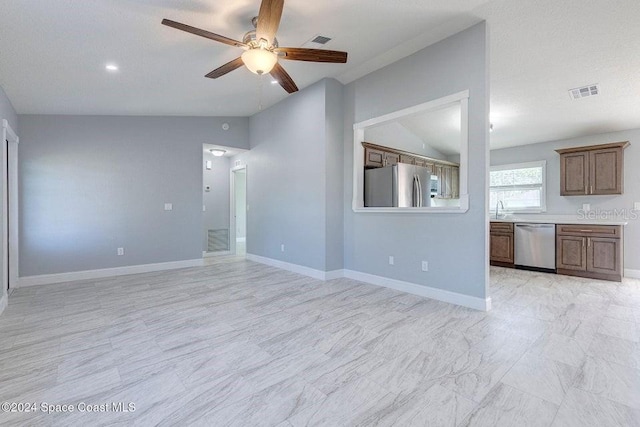 unfurnished living room featuring lofted ceiling, baseboards, visible vents, and a ceiling fan