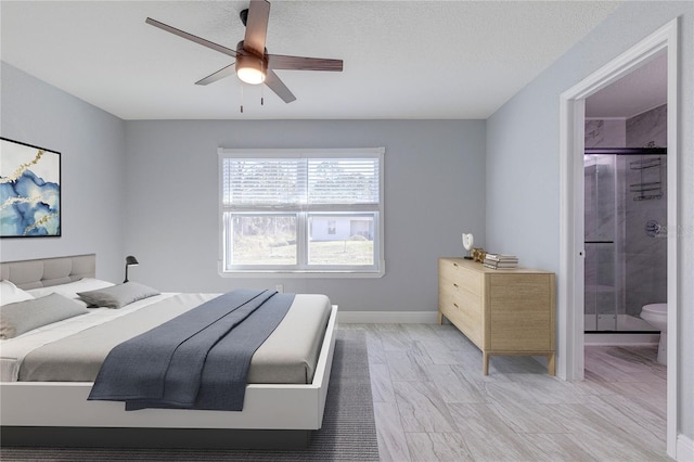 bedroom with connected bathroom, a textured ceiling, baseboards, and ceiling fan