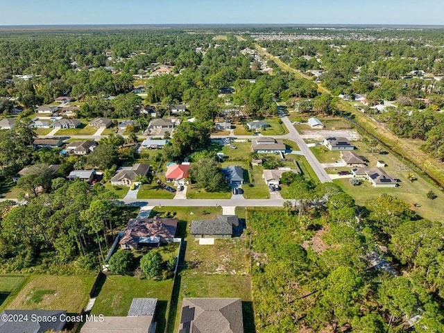 aerial view with a forest view and a residential view