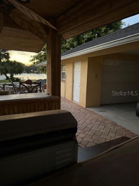 view of patio terrace at dusk