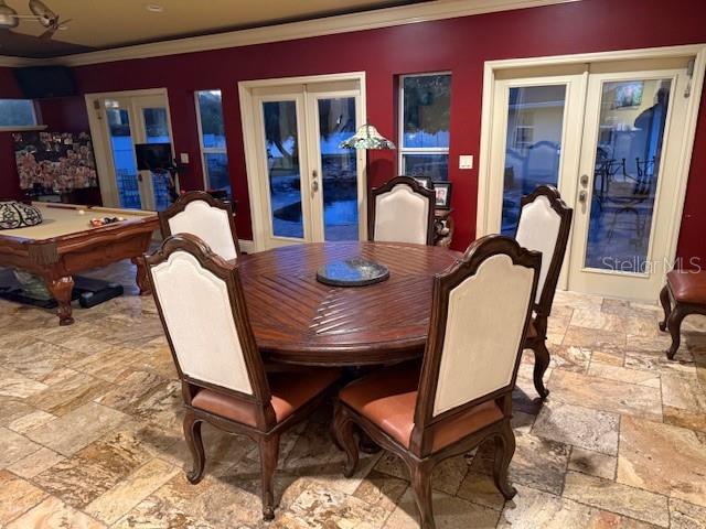 dining space featuring crown molding, pool table, and french doors