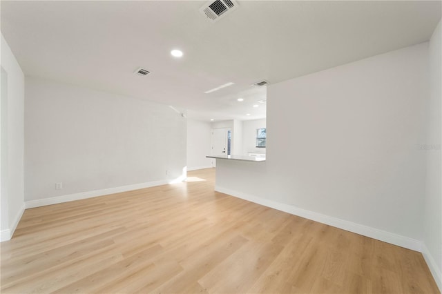 spare room featuring light hardwood / wood-style floors