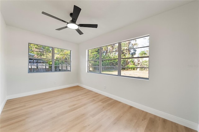 unfurnished room featuring ceiling fan and light hardwood / wood-style flooring