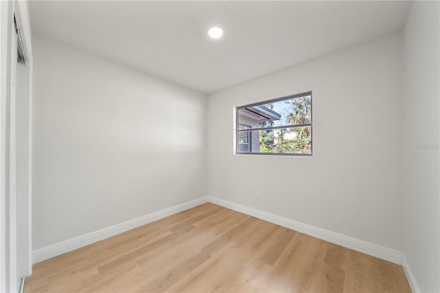 unfurnished room with light hardwood / wood-style floors