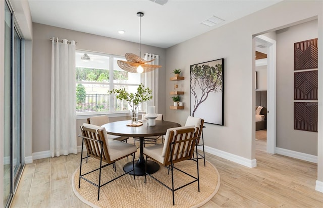 dining area featuring light wood-type flooring