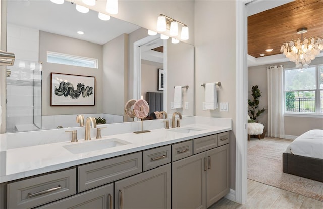 bathroom with hardwood / wood-style floors, vanity, wooden ceiling, and a notable chandelier