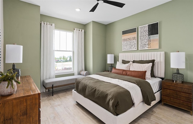 bedroom featuring ceiling fan and light hardwood / wood-style floors