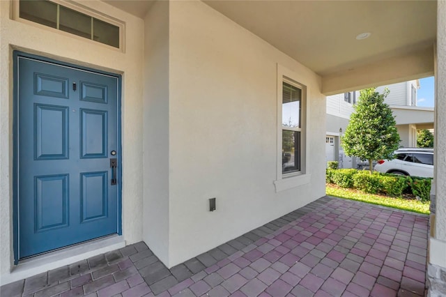 doorway to property with covered porch