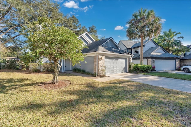 view of front of property featuring a front yard and a garage