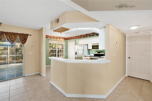 kitchen featuring white cabinetry, electric range, white fridge with ice dispenser, kitchen peninsula, and light tile patterned flooring