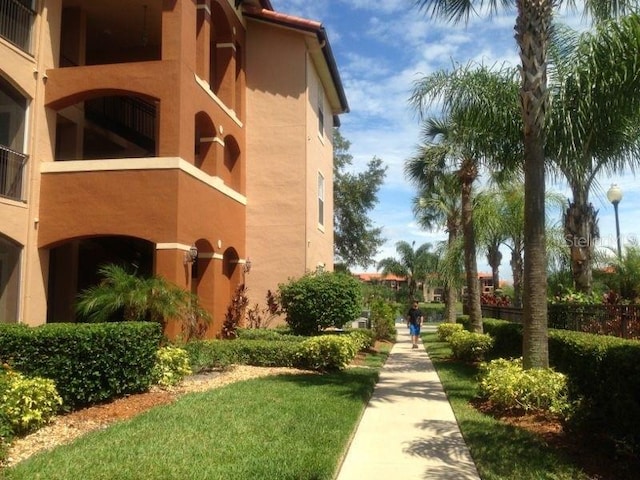 view of home's community with a yard