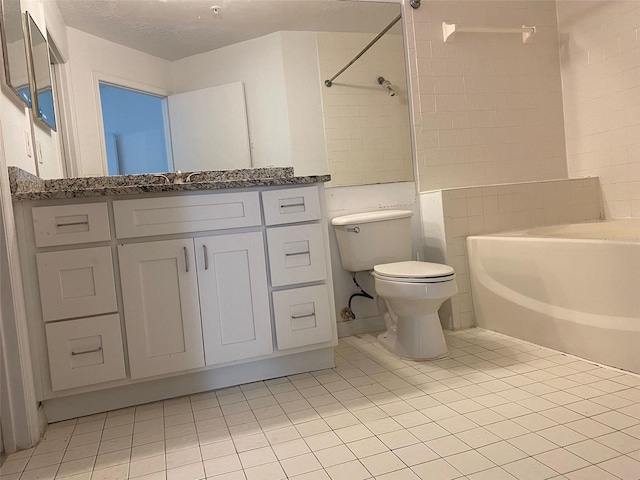 bathroom featuring toilet, a textured ceiling, vanity, and tile patterned floors