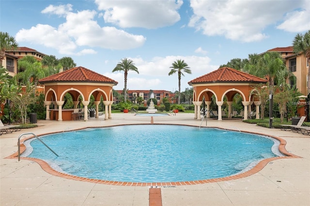 view of swimming pool featuring a patio area