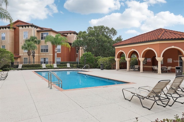 view of swimming pool with a patio