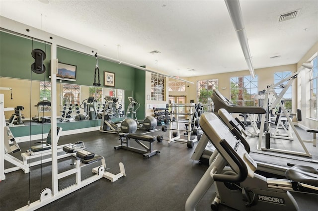 workout area featuring a textured ceiling