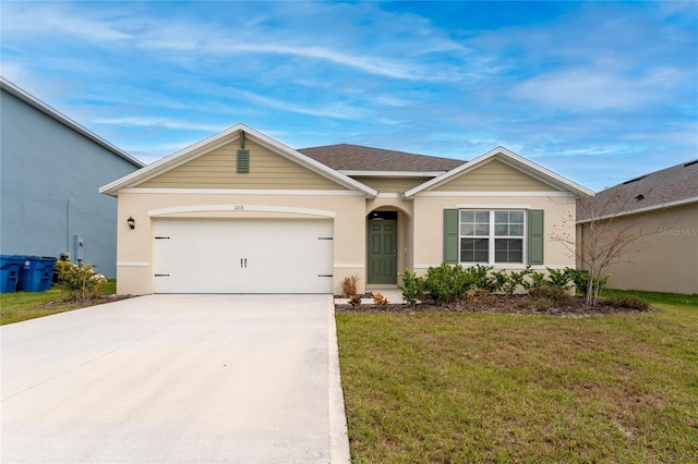 ranch-style house featuring a front lawn and a garage