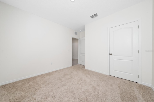 unfurnished bedroom with light carpet