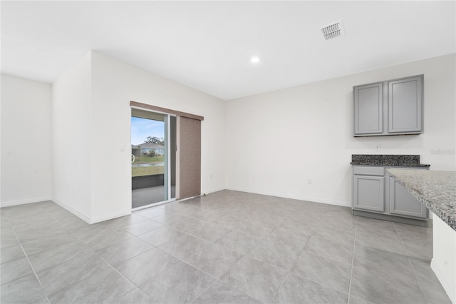 interior space with light tile patterned floors