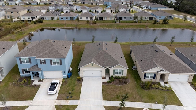 drone / aerial view with a water view