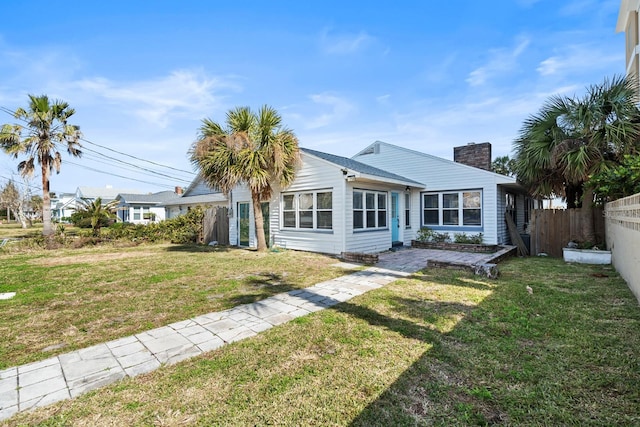 ranch-style home with a front yard