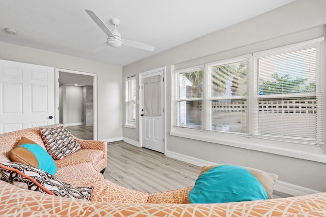 interior space with ceiling fan and light hardwood / wood-style floors