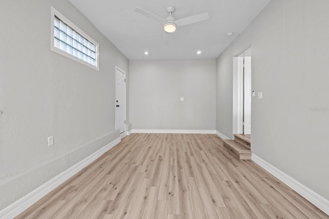 unfurnished room with light hardwood / wood-style flooring and ceiling fan