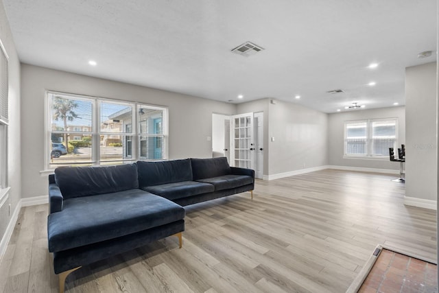 living room with light hardwood / wood-style flooring