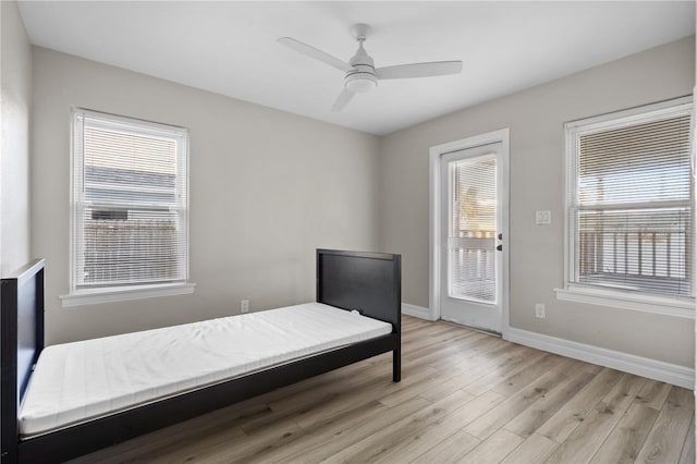 bedroom featuring ceiling fan and light hardwood / wood-style flooring