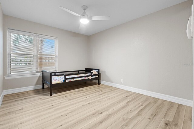 bedroom featuring ceiling fan and light hardwood / wood-style floors