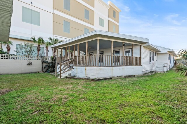 exterior space featuring a porch and a yard