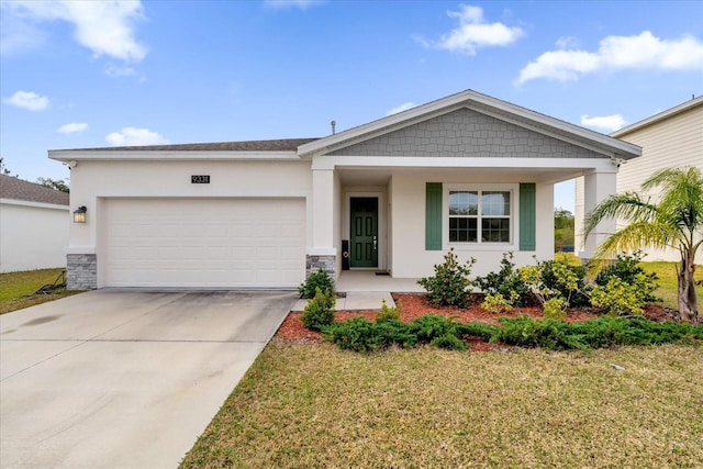 view of front of house featuring covered porch, a garage, and a front yard