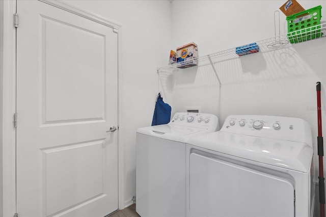 washroom with independent washer and dryer