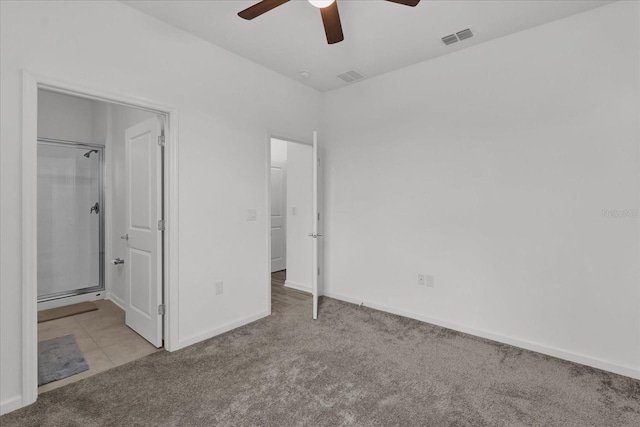 unfurnished bedroom with light colored carpet and ceiling fan