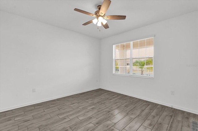 unfurnished room featuring light hardwood / wood-style floors and ceiling fan