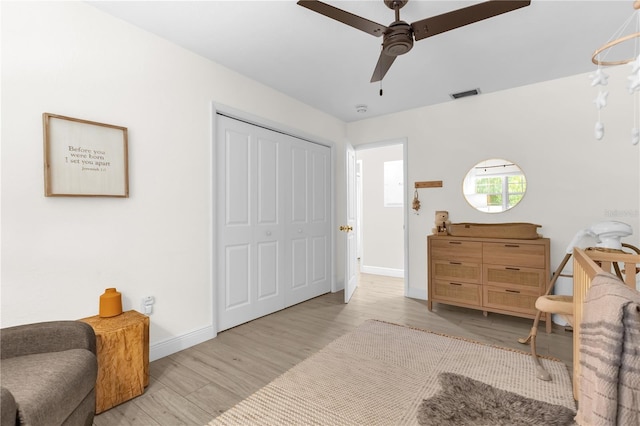 sitting room with ceiling fan and light wood-type flooring