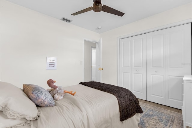 bedroom with a closet, ceiling fan, and light hardwood / wood-style floors