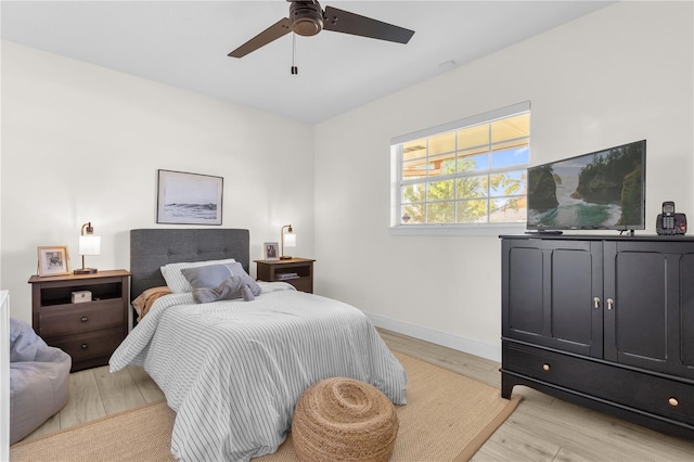 bedroom featuring ceiling fan and light hardwood / wood-style flooring