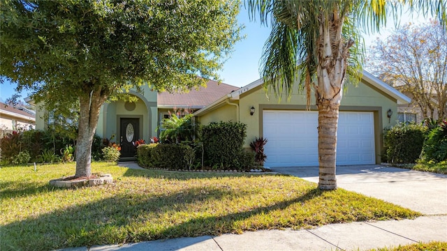 5649 Magnolia Bloom Ter, Oviedo, FL 32765 - view of front of house featuring a front lawn and a garage