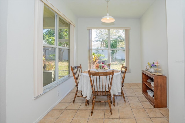 dining area with light tile patterned floors