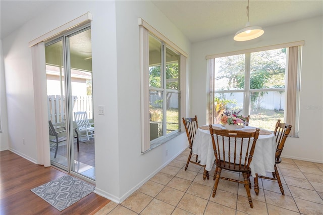 dining room featuring light tile patterned floors and a wealth of natural light