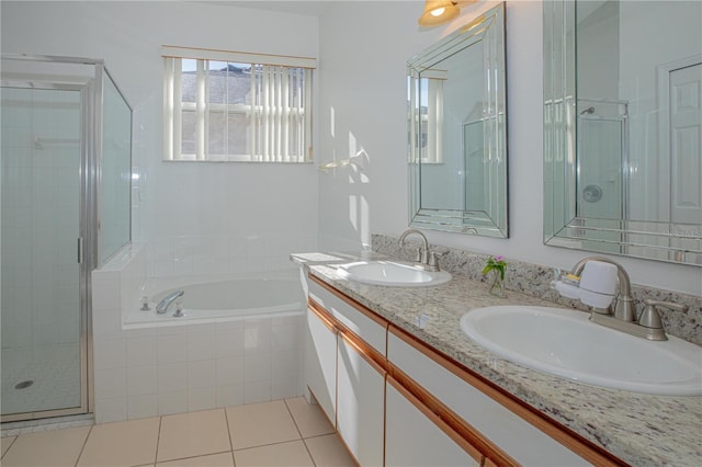 bathroom with vanity, tile patterned floors, and plus walk in shower