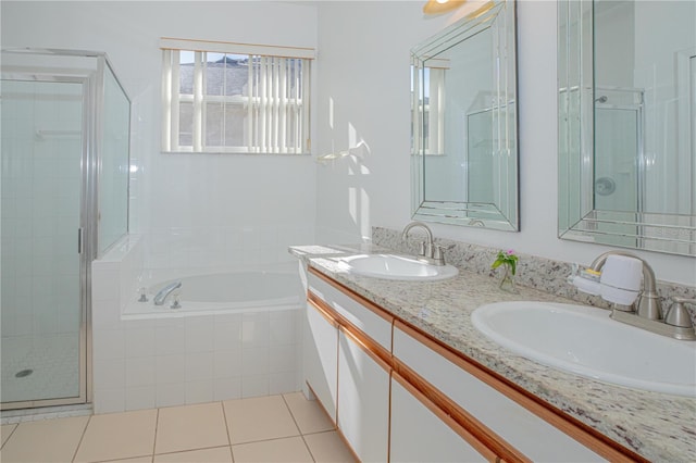 bathroom featuring vanity, tile patterned flooring, and plus walk in shower