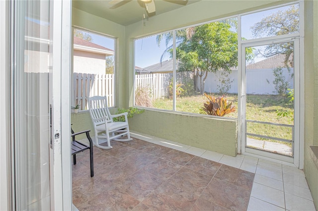 sunroom / solarium featuring ceiling fan