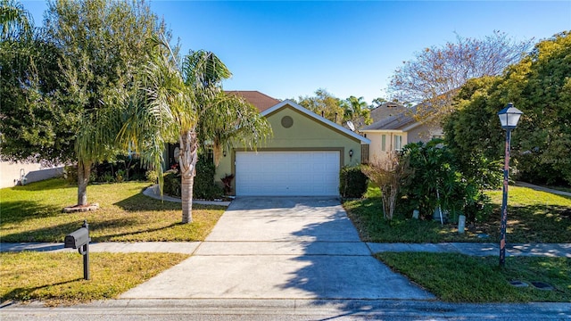 view of front of property with a front lawn and a garage