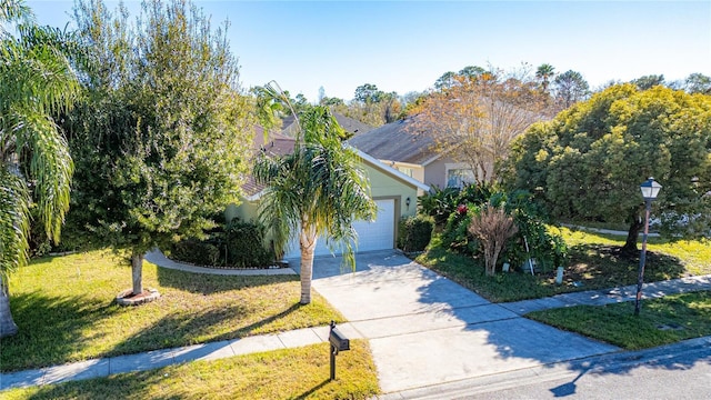 view of front of property featuring a garage and a front yard