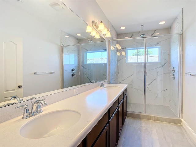 bathroom featuring tile patterned flooring, vanity, and an enclosed shower