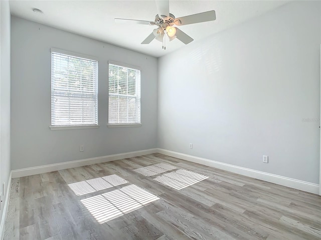 unfurnished room with ceiling fan and light hardwood / wood-style flooring