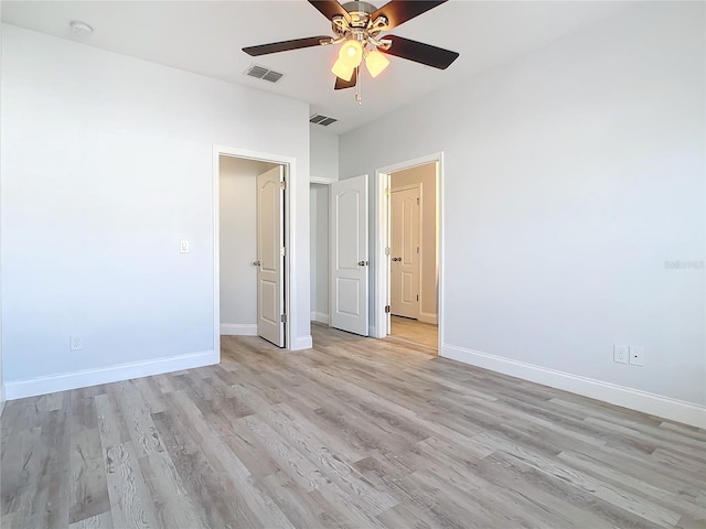 unfurnished bedroom featuring ceiling fan and light hardwood / wood-style flooring