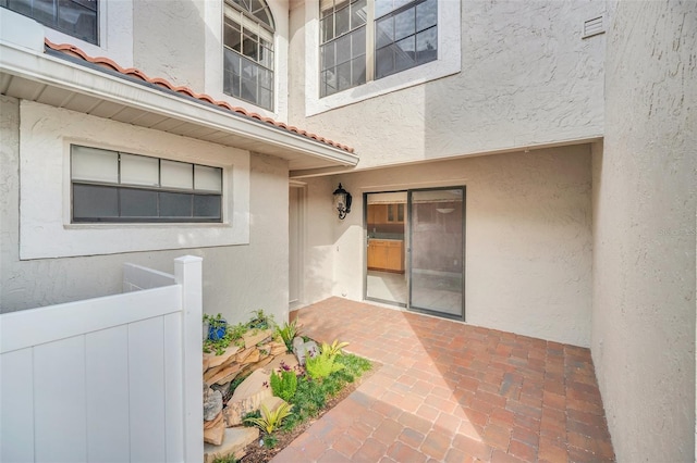 entrance to property with a patio